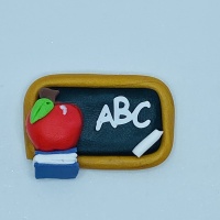 Blackboard with apple and book